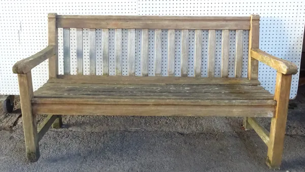 A modern hardwood garden bench, 153cm wide x 90cm high.