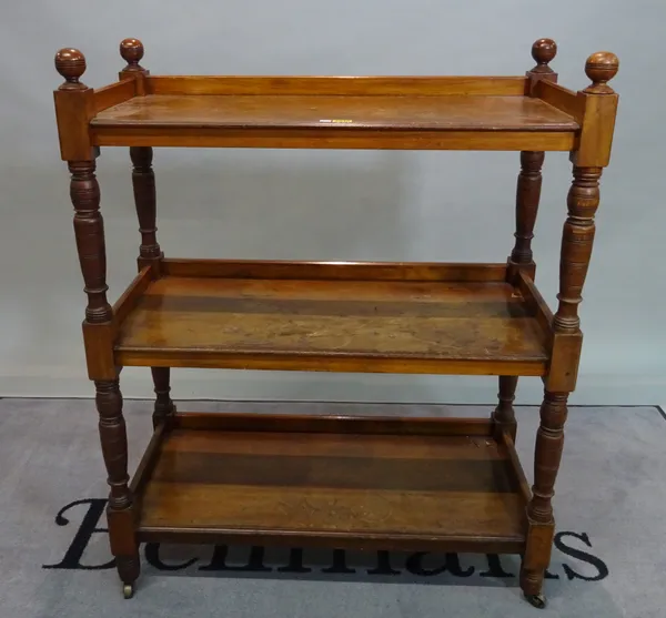 A Victorian walnut three tier buffet, on ring turned baluster supports, 89cm wide x 111cm high.