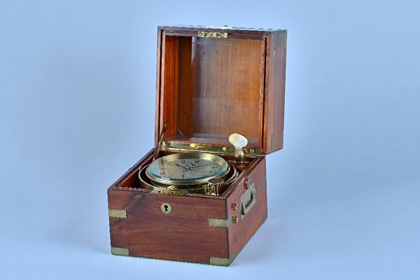 A brass-bound mahogany two-day marine chronometer Signed Christie & Wilson, Glasgow, Circa 1924 The three-tier box with bone roundel signed CHRISTIE &