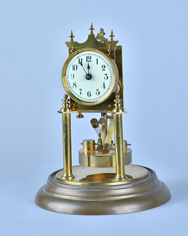 A German torsion action Anniversary timepieceNo. 107756With mercury compensated pendulumUnder a glass dome31cm high overall