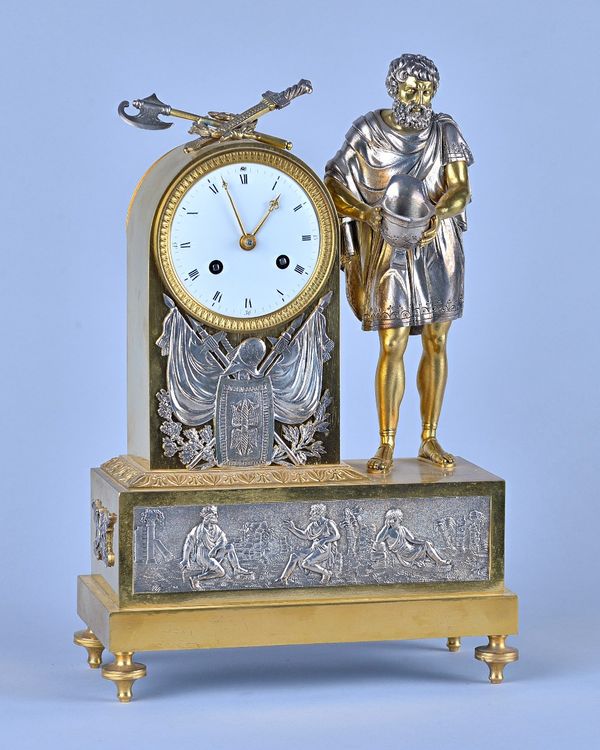 An Empire Ormolu and silvered Mantel ClockModelled with military trophiesThe twin train movement with white enamel dial (restored) and countwheel stri