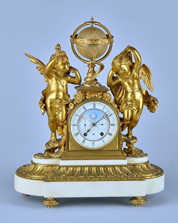 A French ormolu and marble Mantel Clock Late 19th CenturyModelled with two cherubs and a globe, with inset calendar dial and moon aperture, the twin t