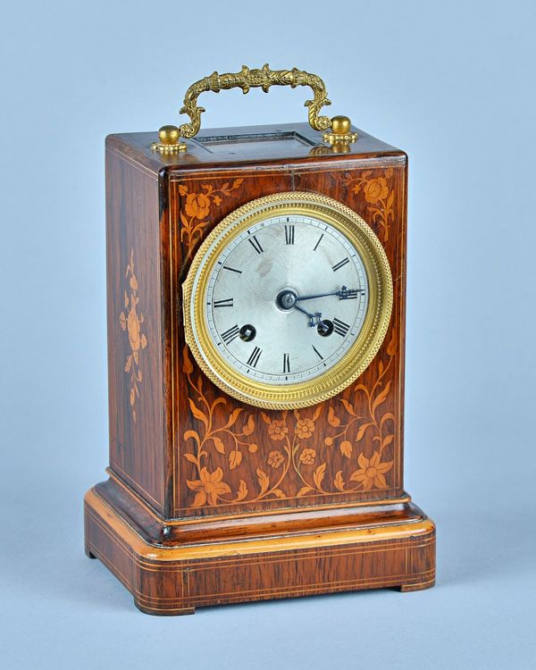 A Louis Philippe giltmetal-mounted rosewood and marquetry inlaid mantel clockWith glazed upper panel above engine-turned dial, the drum-shaped movemen