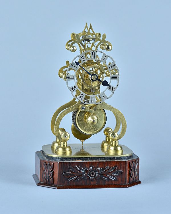 A Victorian brass Skeleton timepieceThe shaped pierced frame with chain fusee and anchor escapement, under a glass dome on carved rosewood base, (1 pe