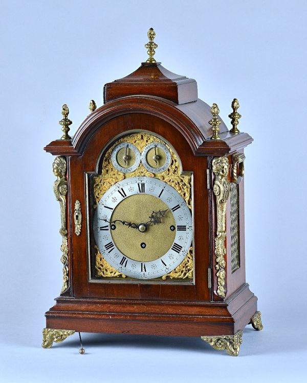 A late Victorian giltmetal-mounted mahogany quarter chiming bracket clockIn the George III styleThe case with stepped pediment above broken arch, flan