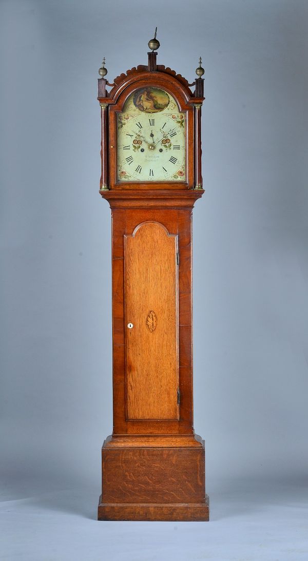 A George III oak and mahogany Longcase clockBy Robert Felmingham, StradbrookThe arched hood with shaped cresting, three finials, flanked by fluted col