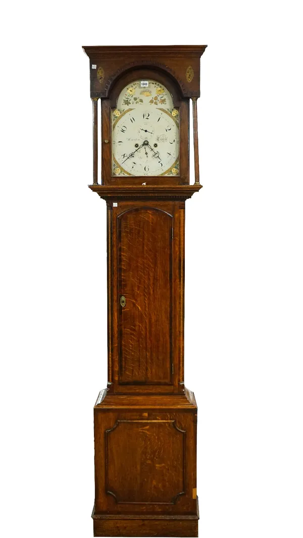 A George III oak longcase clock, the cream and gilt painted arched dial signed 'Martin. Thirsk' the twin train movement striking on a bell, (1 pendulu