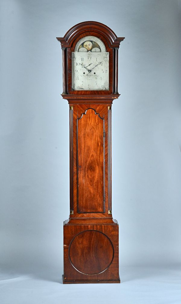A George III mahogany Longcase clockBy William Curtis, ExeterThe arched hood with moulded pediment above fluted columns, the trunk with an arched door