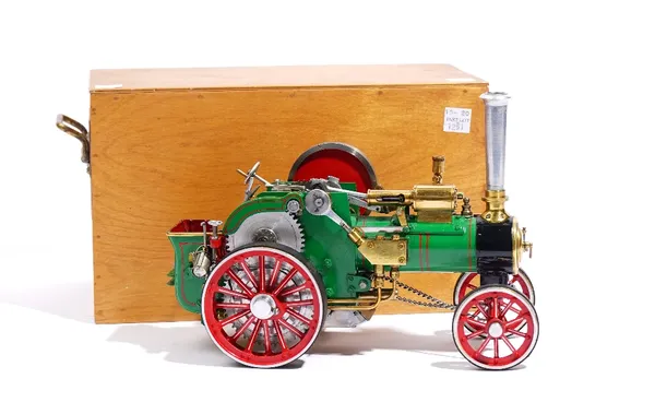 A well engineered scratch built model of a live steam traction engine, early 20th century, finished in green and red, length 24cm, width 11cm, height