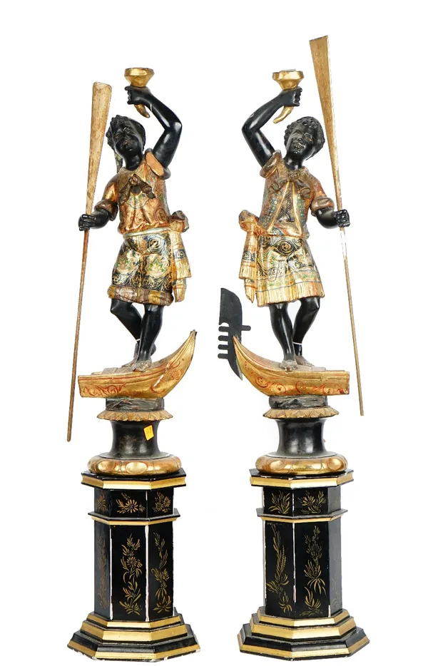 A pair of Venetian parcel-gilt polychrome painted blackamoor figures, circa 1900, with a pair of later hexagonal stands.