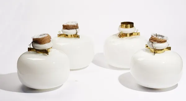 A set of four opaque glass and brass mounted pendant ceiling lights, 28cm diameter. A/S