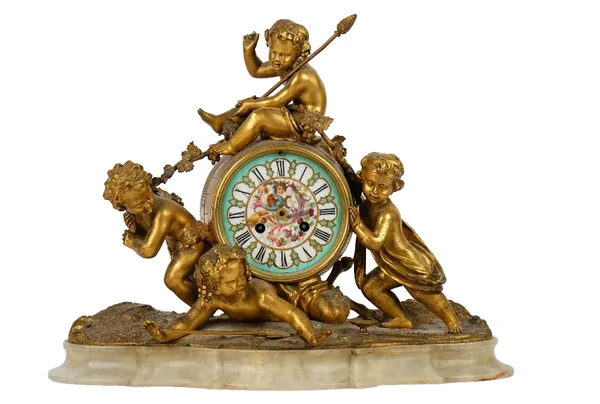 A French gilt-bronze and onyx mantel clock, 19th century, the painted porcelain dial with Roman numerals, the movement signed A. LENAIRE, PARIS, strik