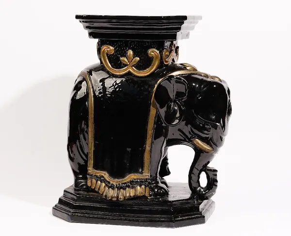 A modern black and gold glazed pottery jardiniere stand, modelled as an elephant, 49cm high.