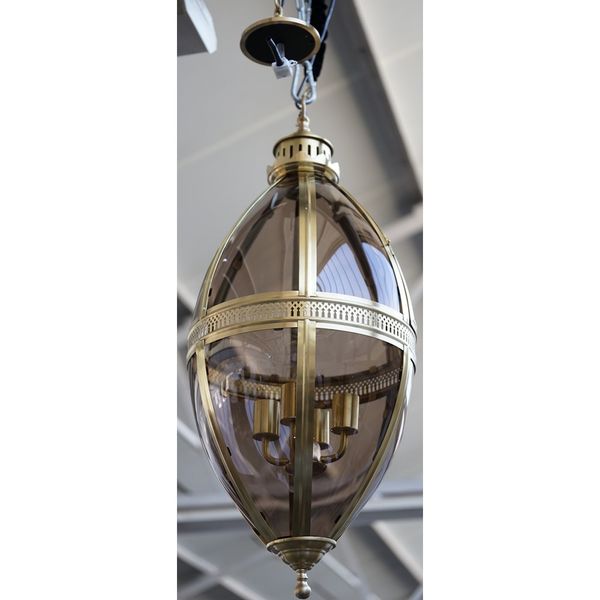 A pair of modern patinated gilt metal lanterns of ovoid form, each with glazed panels, pierced central circlet and internal four light fitment, 90cm h