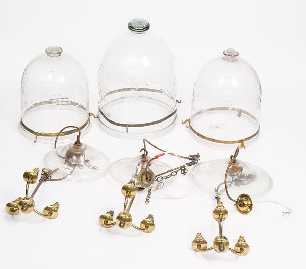 A group of seven etched glass and brass Hindi lanterns, 20th century, with three light fitments. 6758