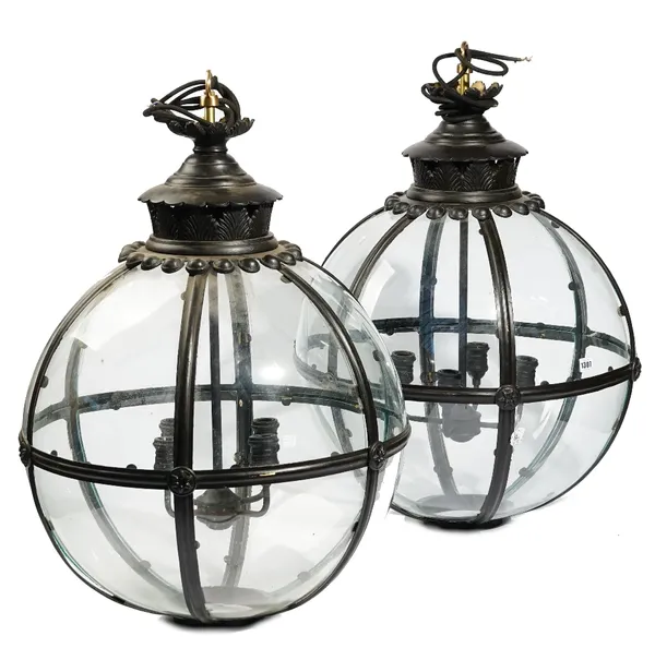 A pair of modern black painted brass globe lanterns, with an internal four light pendant fitment, fitted for electricity, 83cm high (2).