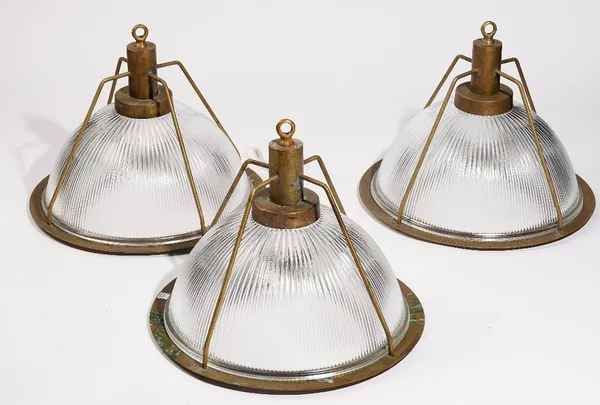 A set of three modern brass and holophane glass industrial ceiling lights, 34cm high (3).