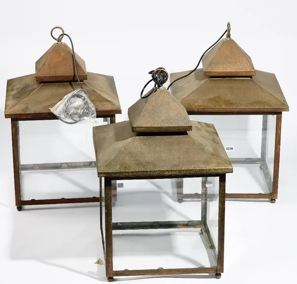 A set of three modern square copper glazed lanterns, 63cm high (3).