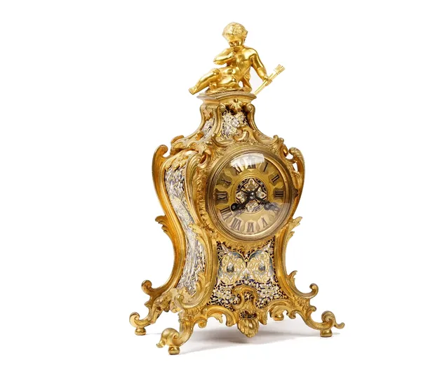 A French gilt metal and champlevé enamel mantel clock in Louis XV style, circa 1870, the shaped case surmounted by a cherub with a quiver of arrows, t