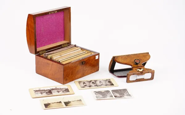 A Swan's patent clairvoyant stereoscope, mid 19th century, fitted in a walnut case, with oval plaque detailed 'The Stereoscopic Treasury', containing