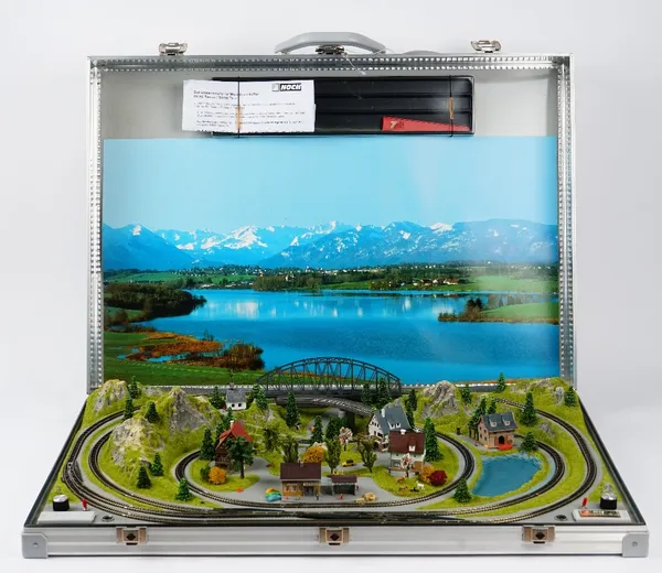 A Noch 88280 Tessin railbag briefcase layout, a Marklin Z startpackung mini-club 81562, one goods train set, two passenger train sets, track cleaning