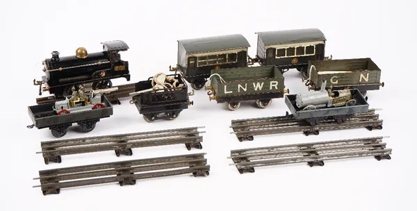 A Hornby O gauge clockwork locomotive, numbered 2710, finished in black, two passenger coaches, two open wagons, circa 1920 and two German wagons with