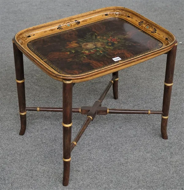 A Victorian papier-mâché tray, decorated with a floral reserve against a faux burr wood ground, quartrefoil and palmette motif border, the underside d