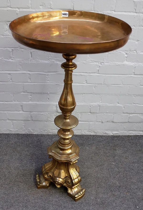 A 19th century lacquered brass alter candlestick, with a later dish top, 94cm high.