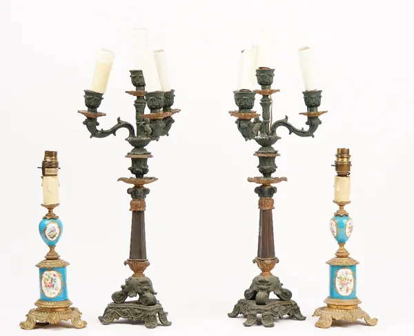 A pair of Sevres style porcelain and gilt metal mounted lamps, 20th century, 33cm high, and a pair of spelter four branch candleabra, 48cm high. (4)