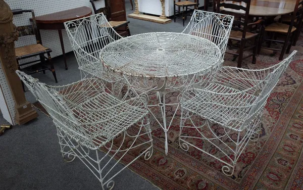 A suite of white painted wire work garden furniture to comprise circular table, 103cm diameter x 76cm high and four matching armchairs, 52cm wide x 88