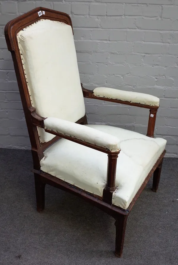 A Victorian Gothic Revival oak open armchair, with pointed back and octagonal arm supports, 67cm wide x 114cm high.