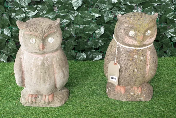 A pair of reconstituted stone figures of seated owls, 40cm high.