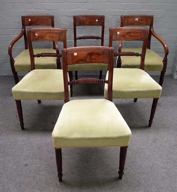 A set of six Regency brass inlaid mahogany dining chairs, with ropetwist waistrail and turned supports, to include a pair of carvers, (6).