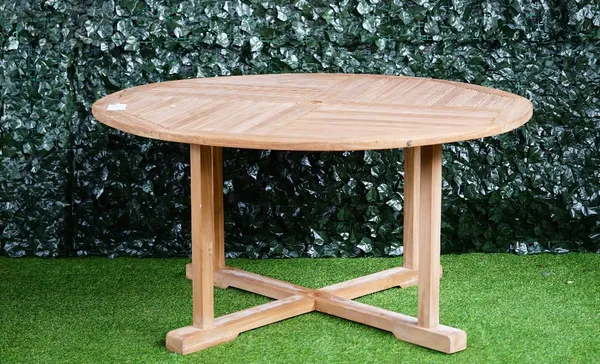 A hardwood circular garden table, of slatted construction, on folding X-frame base, 150cm diameter.