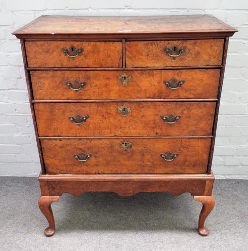 A George III pollard oak chest on stand with two short and three long graduated drawers, the later stand with pad feet, 90cm wide x 110cm high.