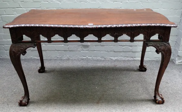 A mid 18th century style mahogany serpentine centre table with pierced and carved frieze on claw and ball supports, 125cm wide x 71cm high.