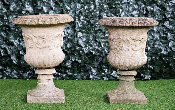 A pair of reconstituted stone jardinieres with semi-fluted bodies and turned socle, diameter 45cm x 64cm high, (2).