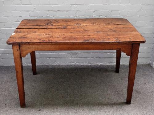 An early 19th century French figured oak plank top kitchen table, on tapering square supports, 81cm wide x 131cm long.