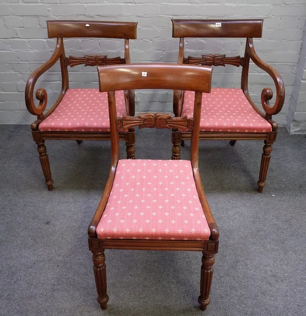 A set of eight George IV mahogany dining chairs with carved waist rail on reeded supports, to include a pair of carvers (8).