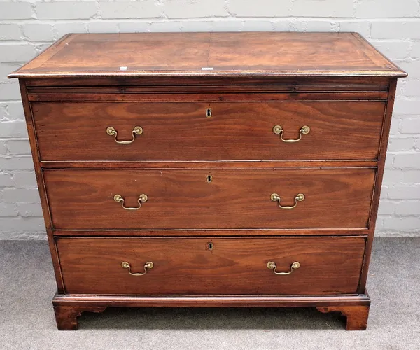 A George III mahogany chest, the brushing slide over three long graduated drawers on bracket feet, 110cm wide x 93cm high.