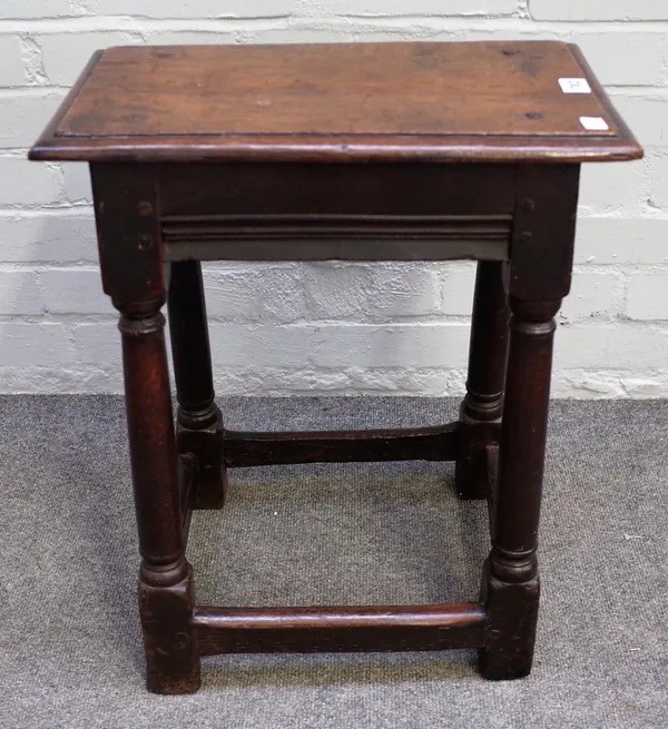 An oak joint stool, 18th century and later, with a moulded rectangular seat, on splayed cylindrical tapering square section legs united by stretchers,