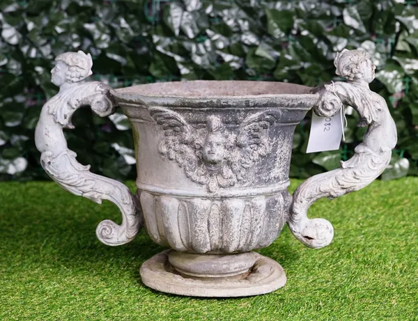 A 19th century lead twin handle urn, with semi fluted body, and turned base, 60cm wide x 35cm high