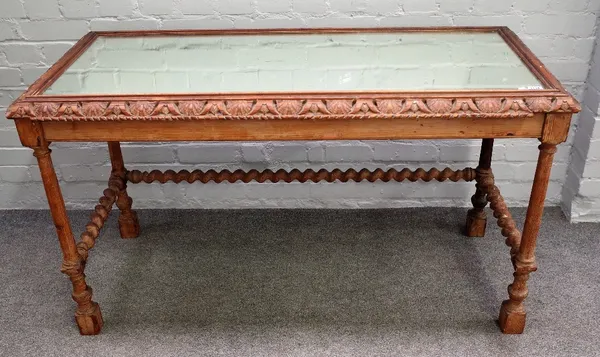 A 19th century Continental pine rectangular side table with mirror inset top on barleytwist supports, 135cm wide x 75cm high.