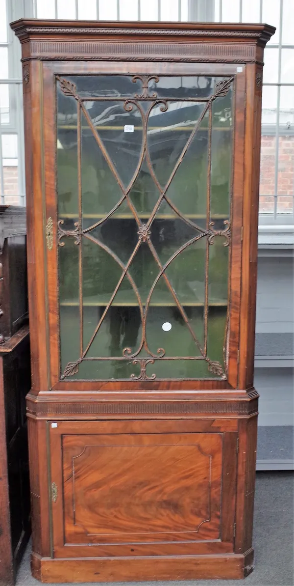 A George III mahogany corner display cabinet cupboard, with astragal glazed door over a single panel door, 94cm wide x 212cm high.