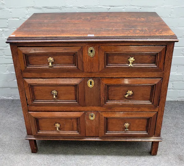 A 17th century and later oak chest, the moulded rectangular top above three block moulded front drawers, on extended stiles, 88cm wide x 57cm deep x 8