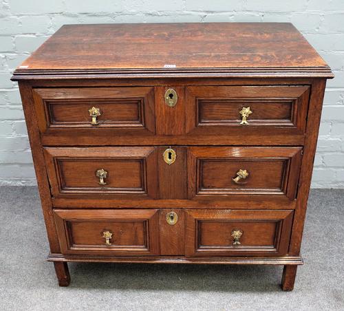 A 17th century and later oak chest, the moulded rectangular top above three block moulded front drawers, on extended stiles, 88cm wide x 57cm deep x 8