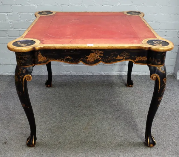 A George I style japanned gaming table, circa 1900, gilt chinoiserie decorated on a black ground, the inset square top with projecting dished circular