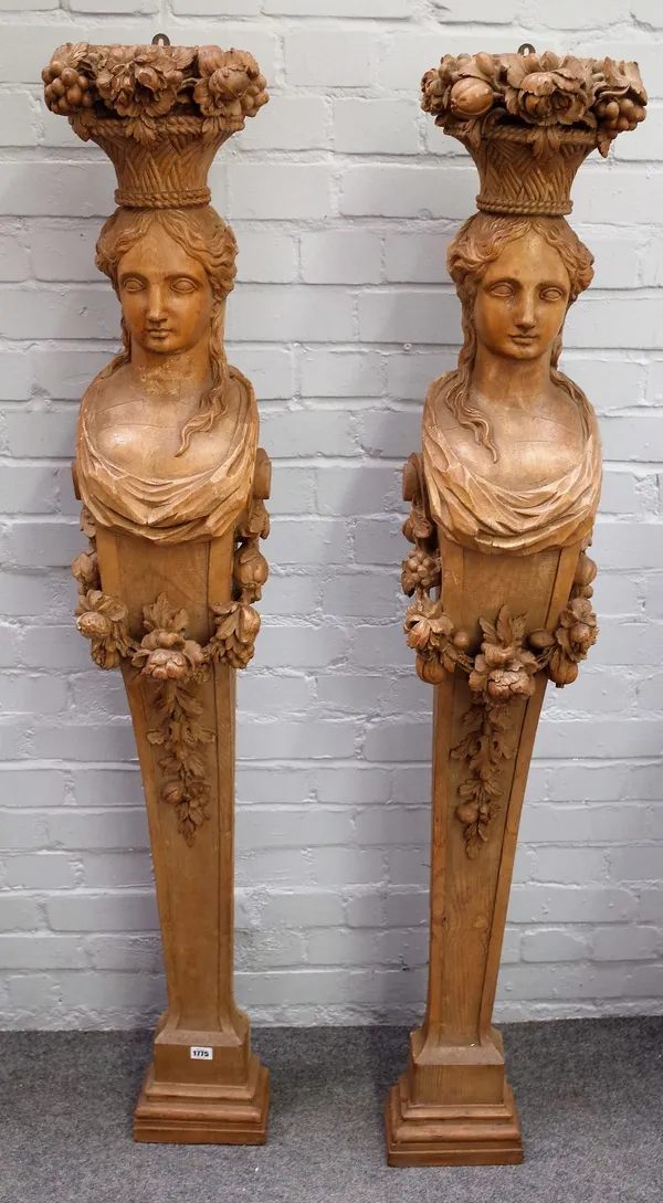 A pair of 19th century carved limewood caryatid mounts/jambs with relief carved floral swags, 148cm high x 24cm wide.