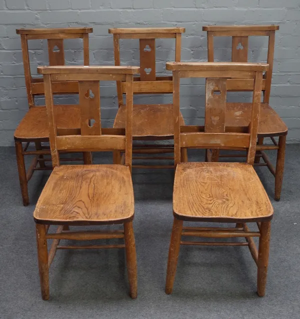 A set of eight early/mid-20th century beech chapel chairs, with trefoil pierced splat on turned supports 38cm wide x 85cm high.