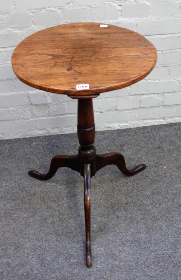 A George III oak pedestal table, the circular top on a vase and ring turned pillar and tripod base, 42.5cm diameter x 69cm high.